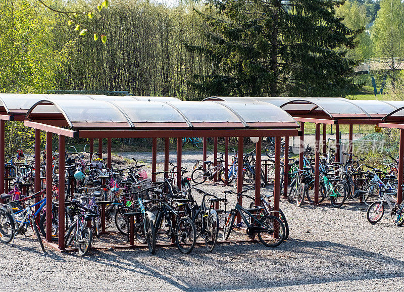 Bicycle parking for schoolchildren in a schoolyard in Lahti, Finland. Summer time of the year.